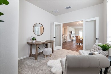 French doors create a classic entrance into the de