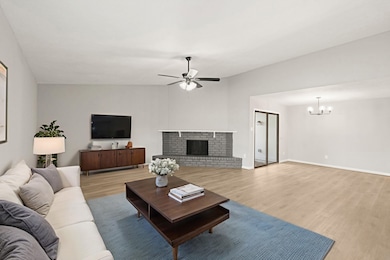 ANOTHER VIEW OF THE GENEROUS LIVING SPACE EMPHASIZING THE FOCAL POINT, FIREPLACE. *Virtually Staged
