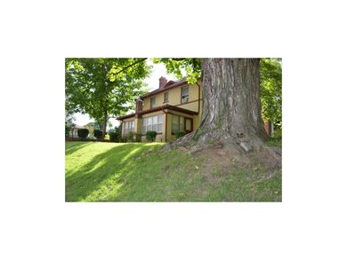 East side view, enclosed porch, with entry from th