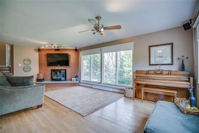 Hardwood floors flow through the open living and d