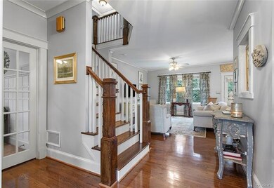 French doors at left lead to the Study, ahead to t