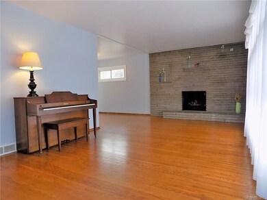 Gleaming Hardwood Floors In The Living Room & Dini