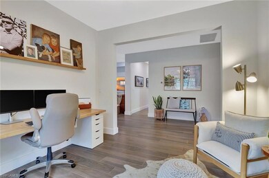 Office area featuring baseboards, visible vents, a