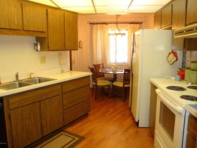 6 VIEW OF KITCHEN FROM GARAGE ENTRANCE