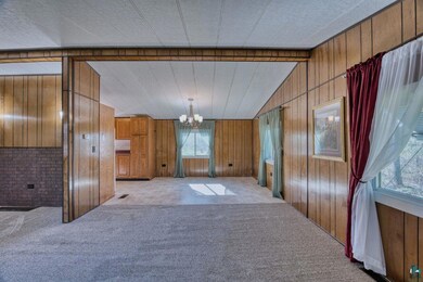 Unfurnished dining area with a chandelier, carpet 