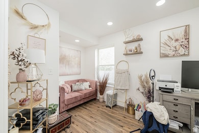 Home office with recessed lighting and wood finished floors