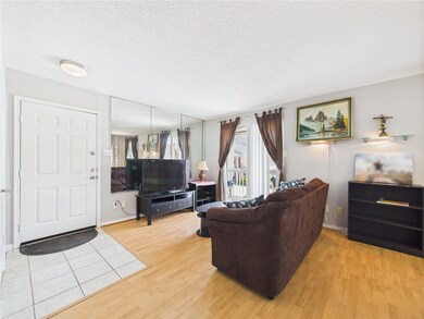 Living Room w/Sliding Glass Door to Private Balcon
