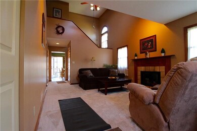Warm and inviting living room with cathedral ceili