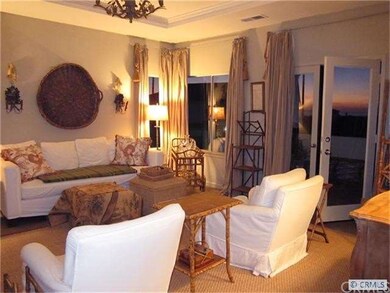 Living room with balcony and sunset view