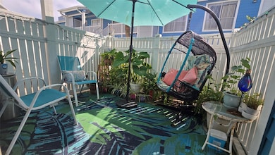 So, about that spacious patio! Patio! Plants! Trop