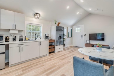 Kitchen with a sink, light countertops, healthy a