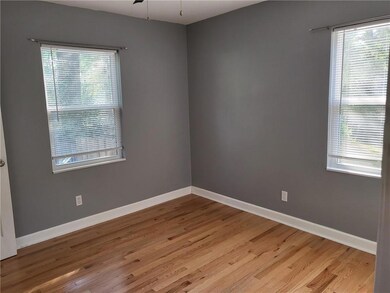 Unfurnished room with light wood finished floors and ceiling fan