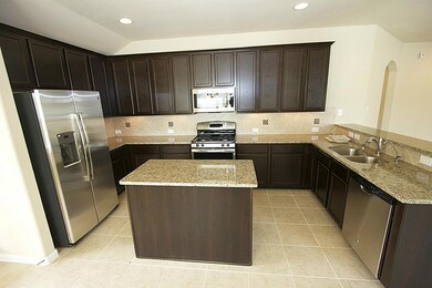 Spacious island kitchen with stainless steel appli