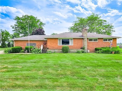 Ranch-style home featuring a front yard