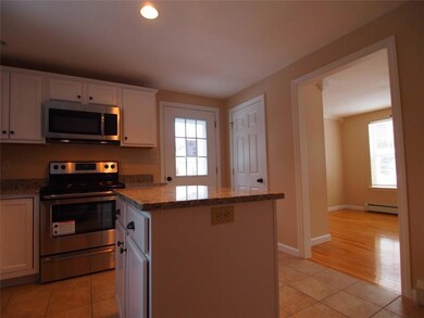 Kitchen is open to bright spacious...