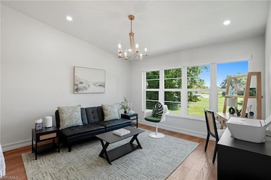 Light-filled open space with flexible layout, highlighted by oversized windows and serene outdoor views.