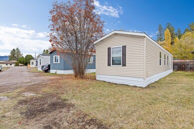 Inviting curb appeal in a quiet community setting showing the home and neighboring properties