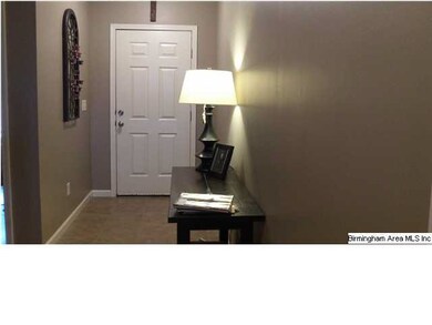 Front hallway featuring hardwoods throughout famil