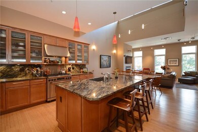 Open concept kitchen and living room includes vari