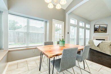 Breakfast room open to the family room. Wall of windows give off lots of natural light!