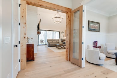 You will be drawn to the beauty of nature as you step inside the spacious foyer and see the private views straight through on the other side of the home.