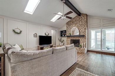 Living room with dark wood-style floors, lofted ce