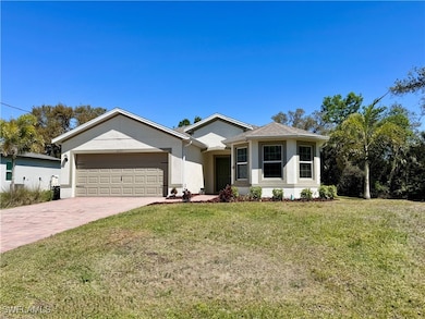 Single story home featuring stucco siding, an atta