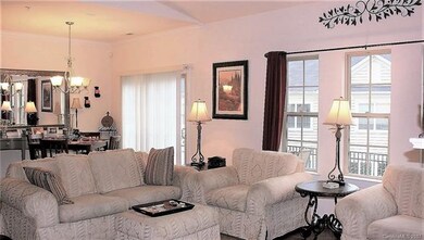 Great room with large dining area and sliders lead