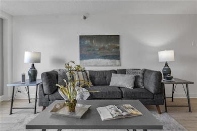Living room with wood finished floors and baseboards
