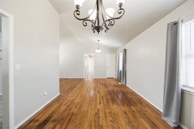 Unfurnished dining area featuring lofted ceiling, 