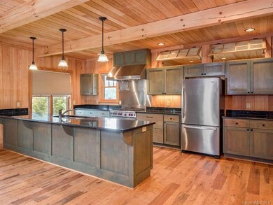 The designer kitchen features high end appliances 