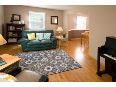 Gorgeous floors flow from the living room to the d