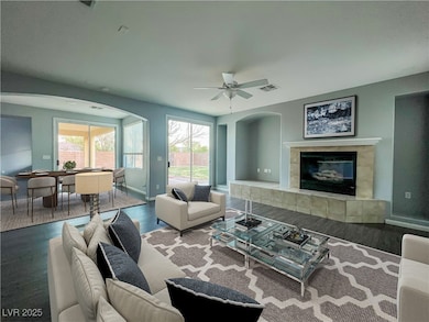 Living room with dark wood-style flooring, visible