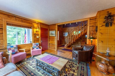 Living room featuring wood-type flooring, a textur
