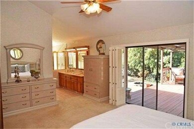 Sliding doors in master suite leading to backyard,