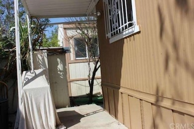The cement patio at the back of the home is perfec