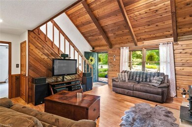 As you enter this home from the front porch you enter into this cozy den with vaulted ceilings, laminate flooring and wood accents.