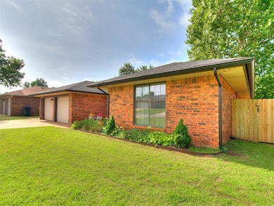 Ranch-style home with brick siding, concrete driveway, and an attached garage