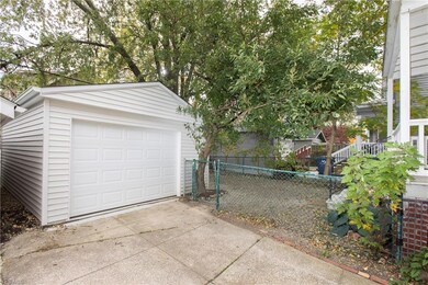 View of fenced in yard and new garage