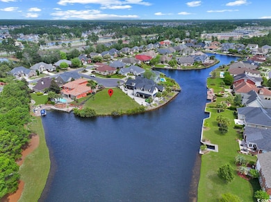Aerial view featuring a water view and a residenti