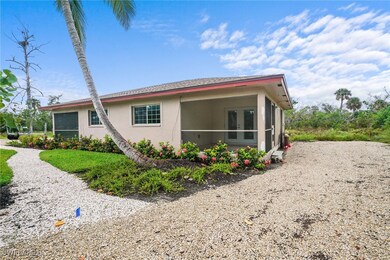 View of home's exterior with a sunroom and stucco siding