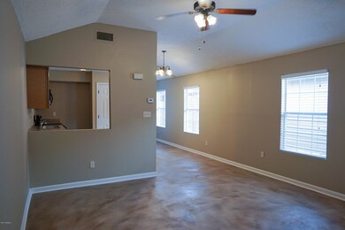 Living room leads to Kitchen