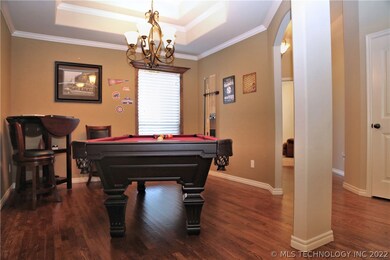 Open Formal Dining room with hardwood floors also