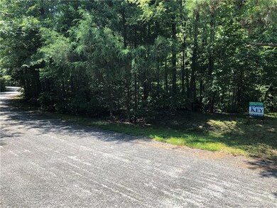 Center of two lots to the left of the sign
