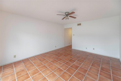 Unfurnished room with a ceiling fan