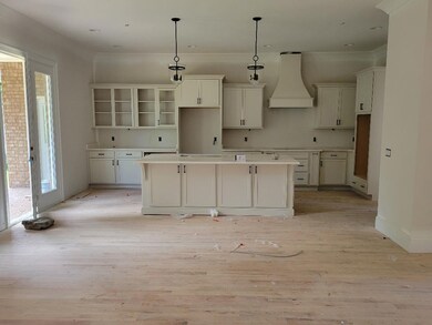 Upgraded quartz counters; matte black light/fan package. KitchenAid appliances on the way including double ovens and gas cooktop.