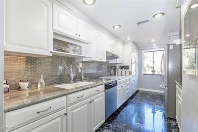 Kitchen featuring appliances with stainless steel