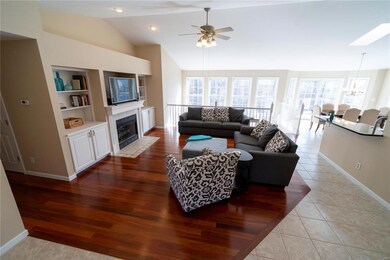 Hard wood floors, built in cabinets, vaulted ceili