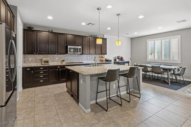 Kitchen featuring light tile patterned floors, sta