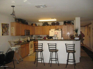Kitchen w/ breakfast bar & tile counters